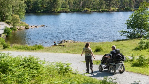 Visitors at Tarn Hows near Hawkshead, Cumbria
